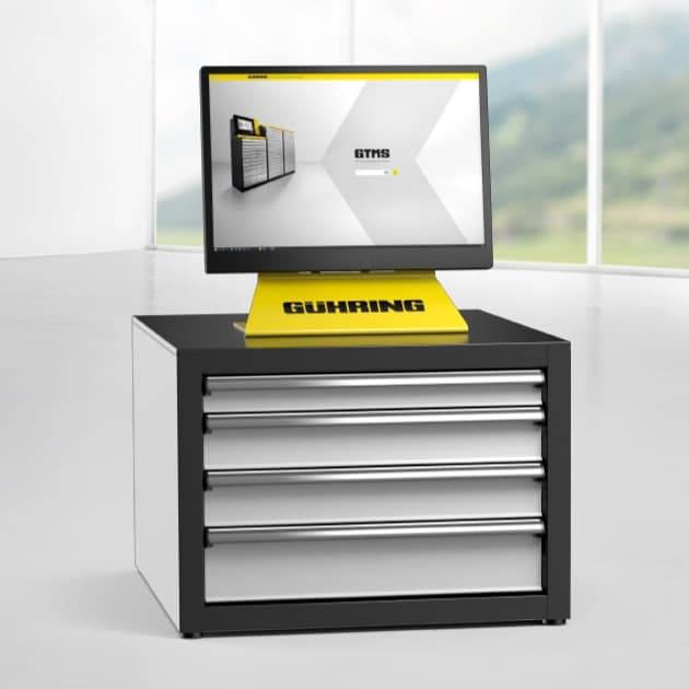 Die TM-minibox für die digitale Werkzeugverwaltung  von Gühring mit Monitor und drei Schubladen