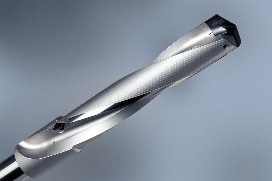 Close-up of an indexable insert drill with visible cutting insert and shiny metallic shank