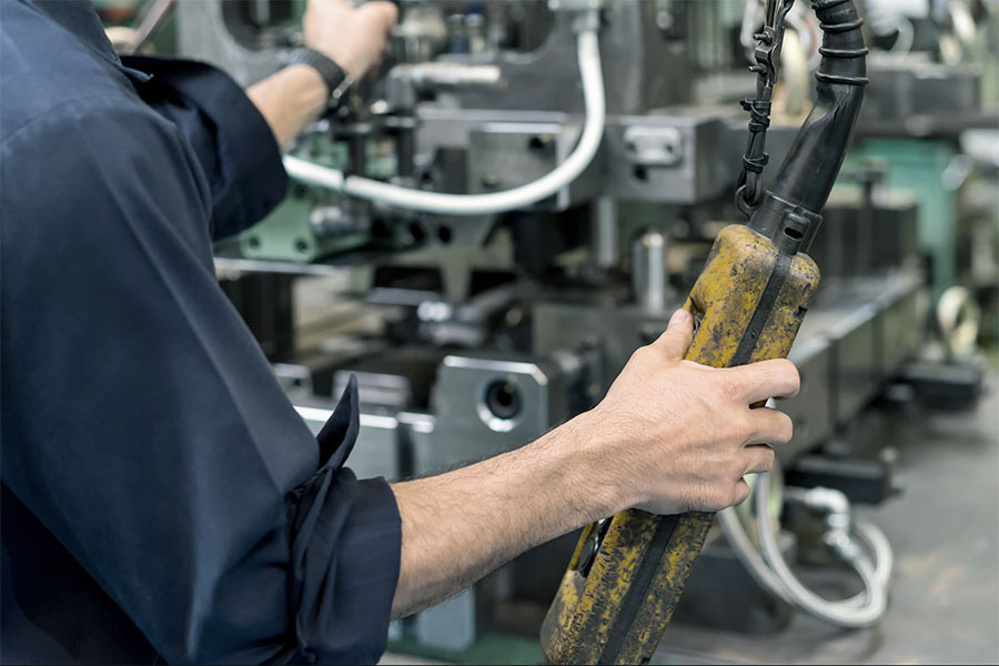 Worker operating machine controls in an industrial environment