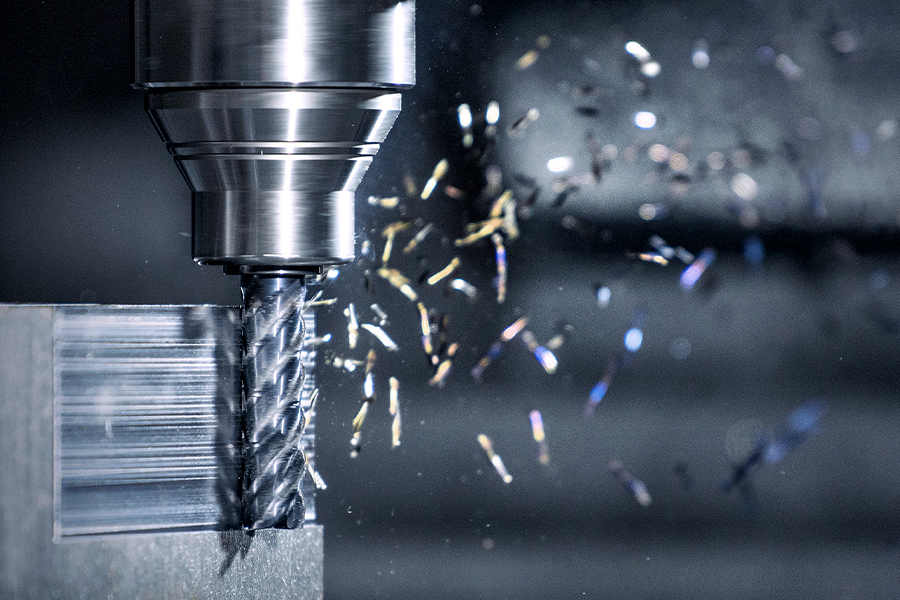 A roughing cutter in action, removing material from a metallic workpiece