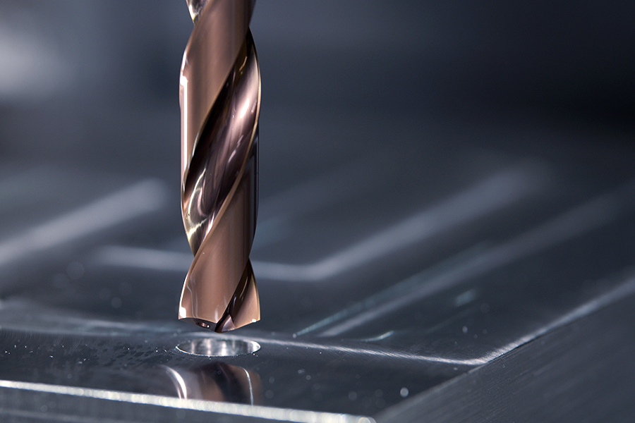 InoxPro solid carbide drill in action, shown drilling into a metal plate
