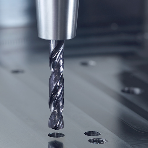 Drilling holes in a metal mould plate in tool and mould making