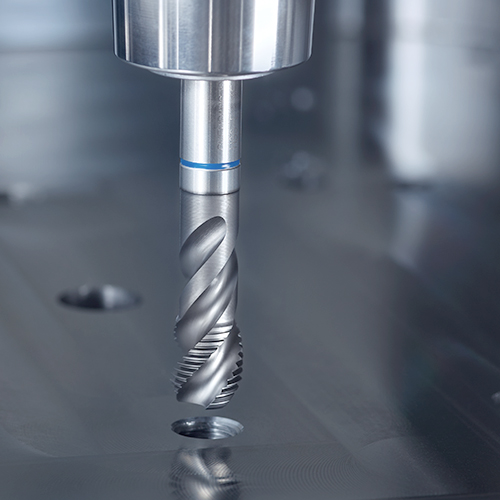 Drilling holes in a metal mould plate in tool and mould making