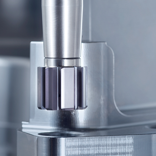 Reaming and countersinking tool in use on a metal component in tool and mould making