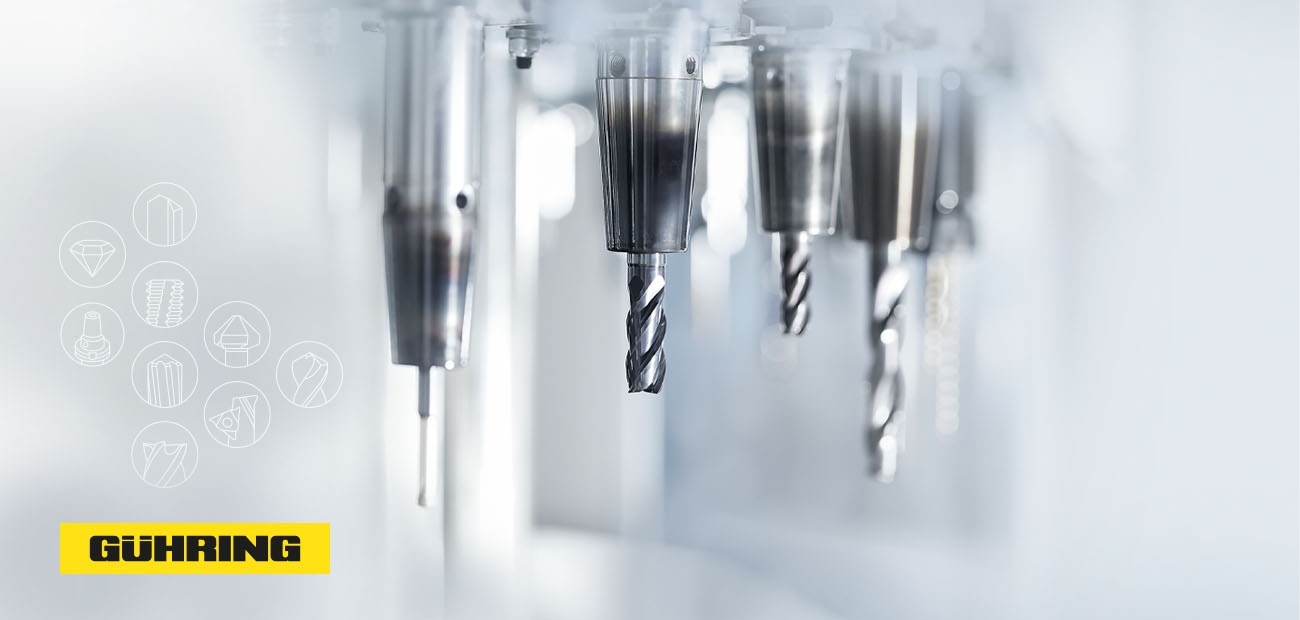 The picture shows a tool magazine with several precision tools in a machine including the Gühring manufacturer logo