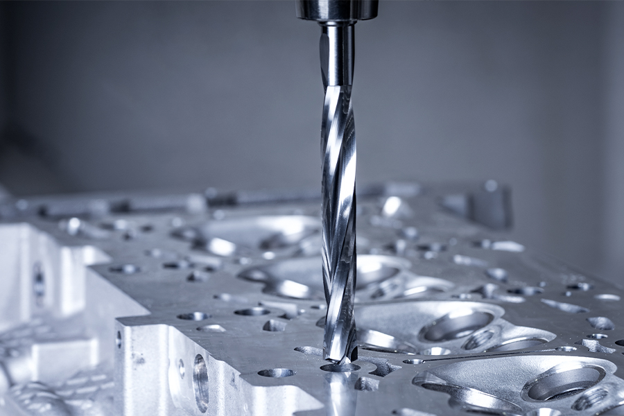 High-precision CNC drilling focussed on a metal drill in the machining of an engine block