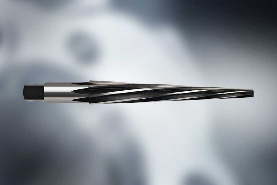 Close-up of a taper reamer with spiral cutting edges