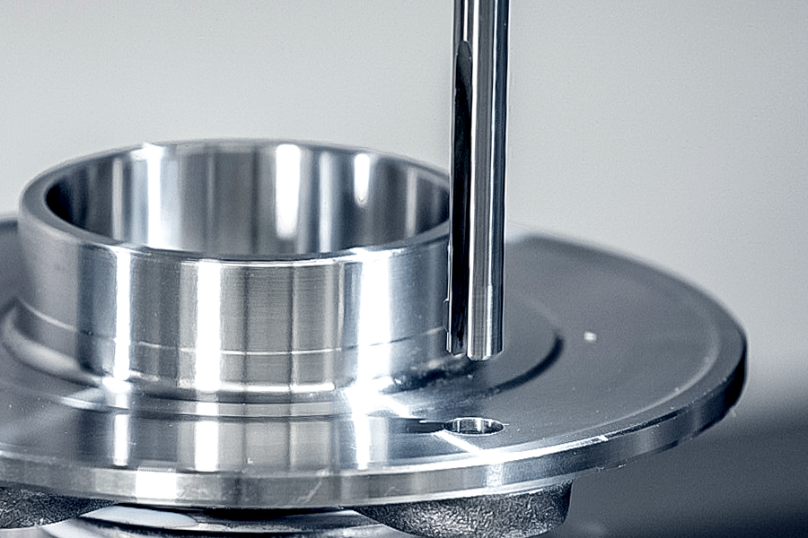 Workpiece is machined with a deburring tool