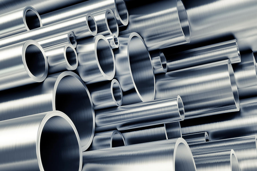 Stack of shiny metal tubes in various sizes and diameters