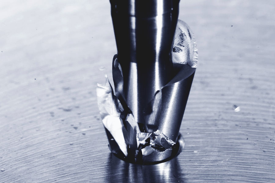 Tap breaks during use, leaving fragments and chips visible on a metallic surface