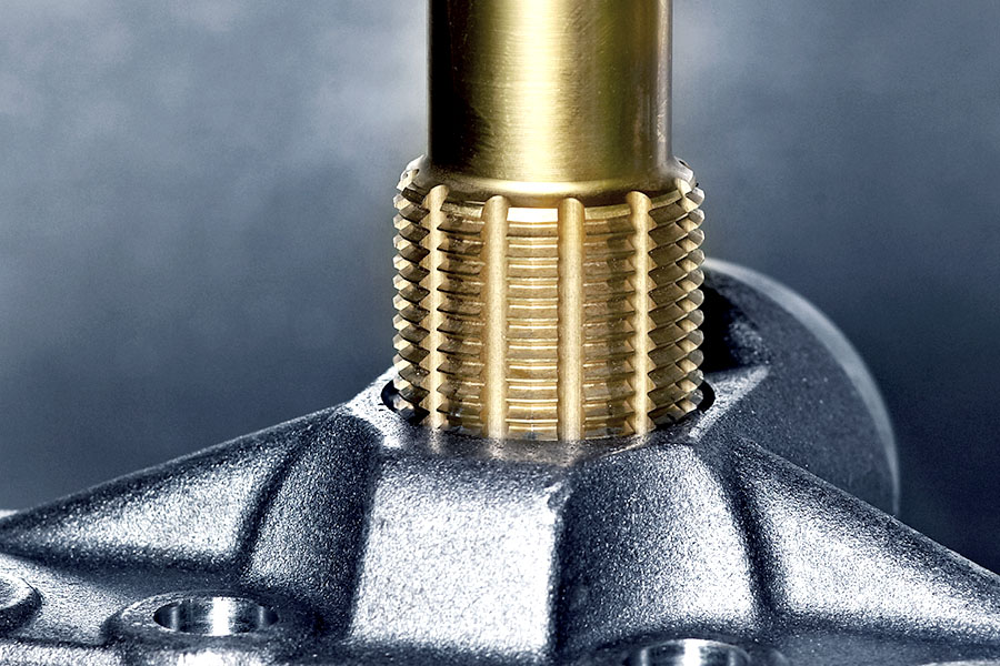 Thread former in action, forming precise threads in a metal component