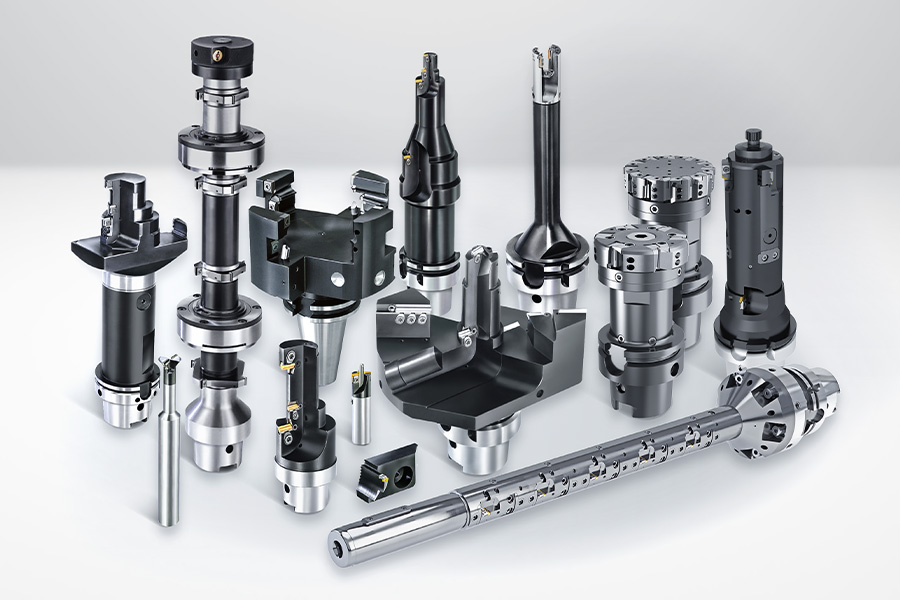 Diverse selection of high-precision tool systems and components for metalworking, presented on a neutral surface