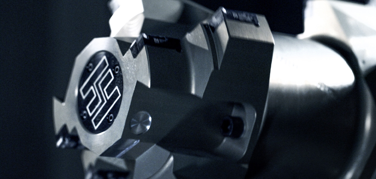 A high quality cutting tool with a distinctive geometric logo, representing Hollfelder, on the front