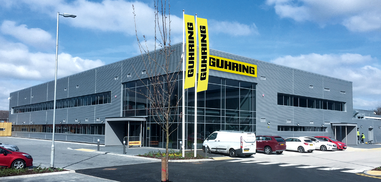 The picture shows a tool magazine with several precision tools in a machine including the Gühring manufacturer logo